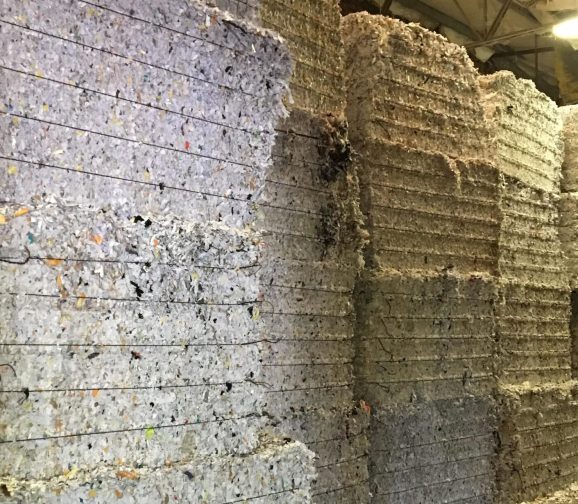 Shredded paper bales from document destruction equipment supplied by HMS