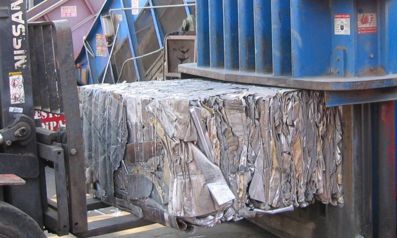 Two ram baler for aluminum, copper, and nonferrous scrap metal recycling
