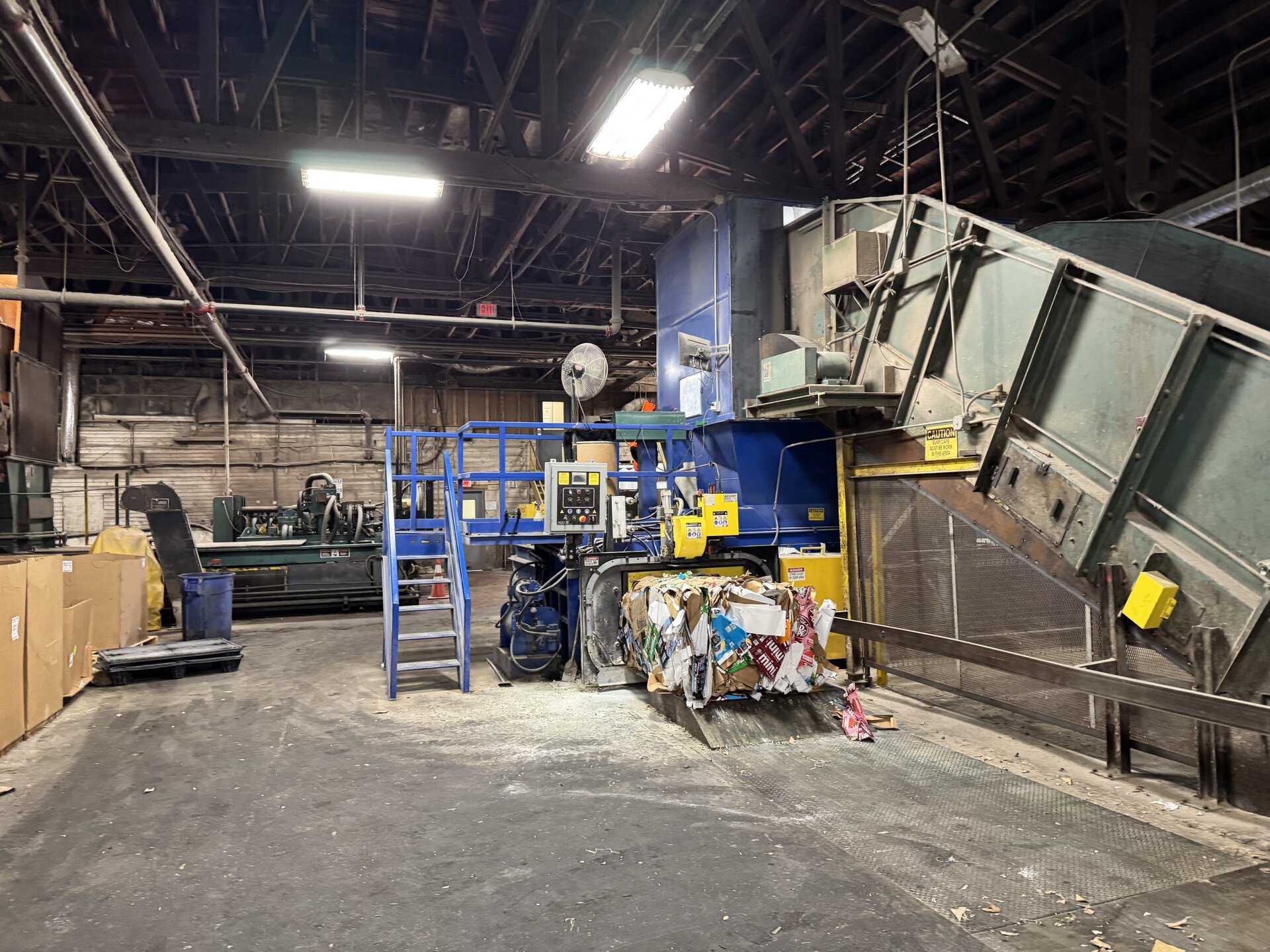 Recycling baler running after HMS service repair and maintenance at customer facility