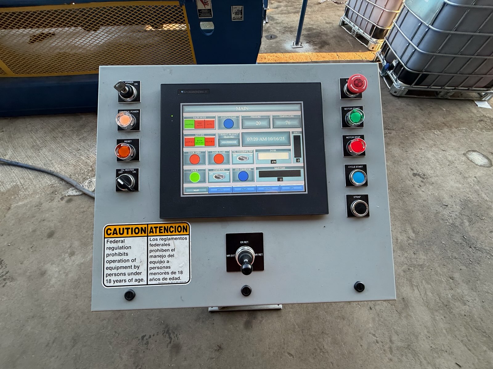 HMS technician performing PLC controls upgrade and electrical service on recycling baler