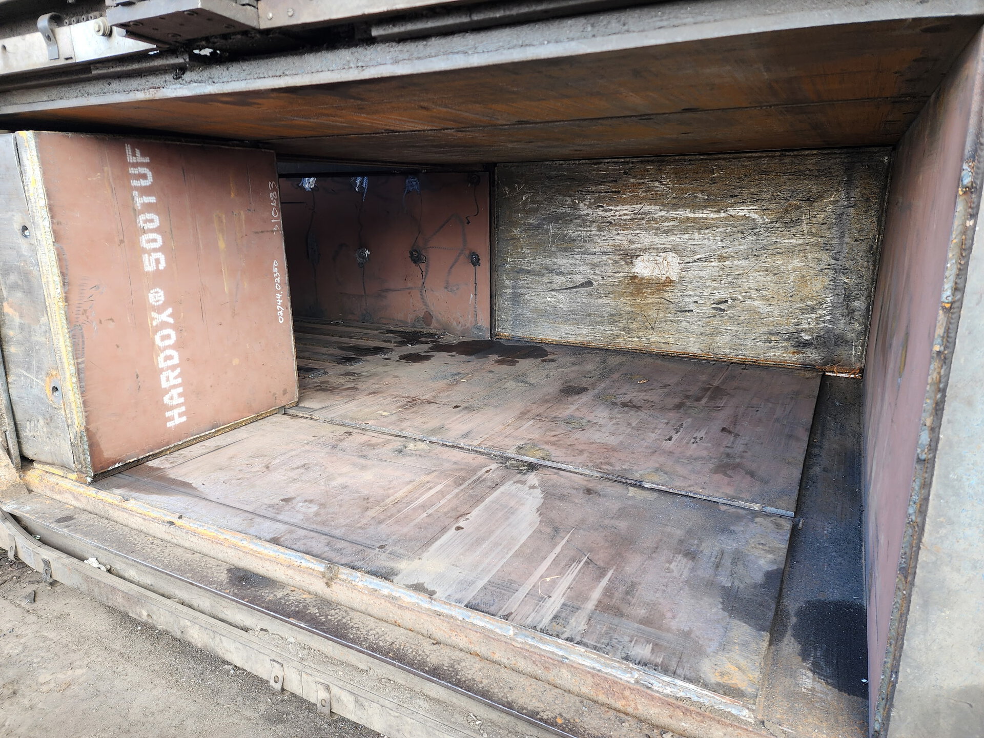 Close up of new wear liners installed on a baler bale separation door by HMS during a reline