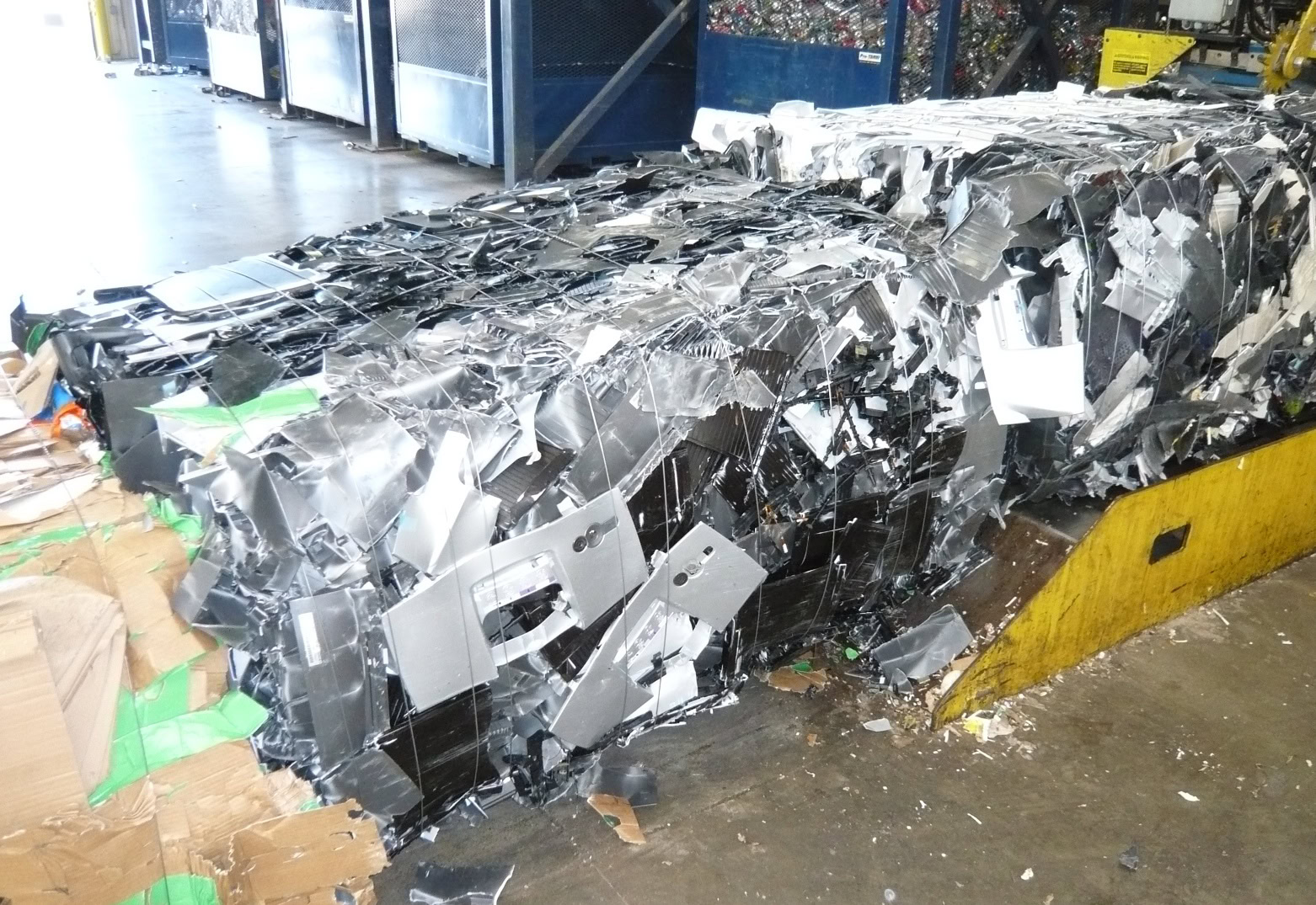Balers, shredders, and conveyors for plastics recycling operations