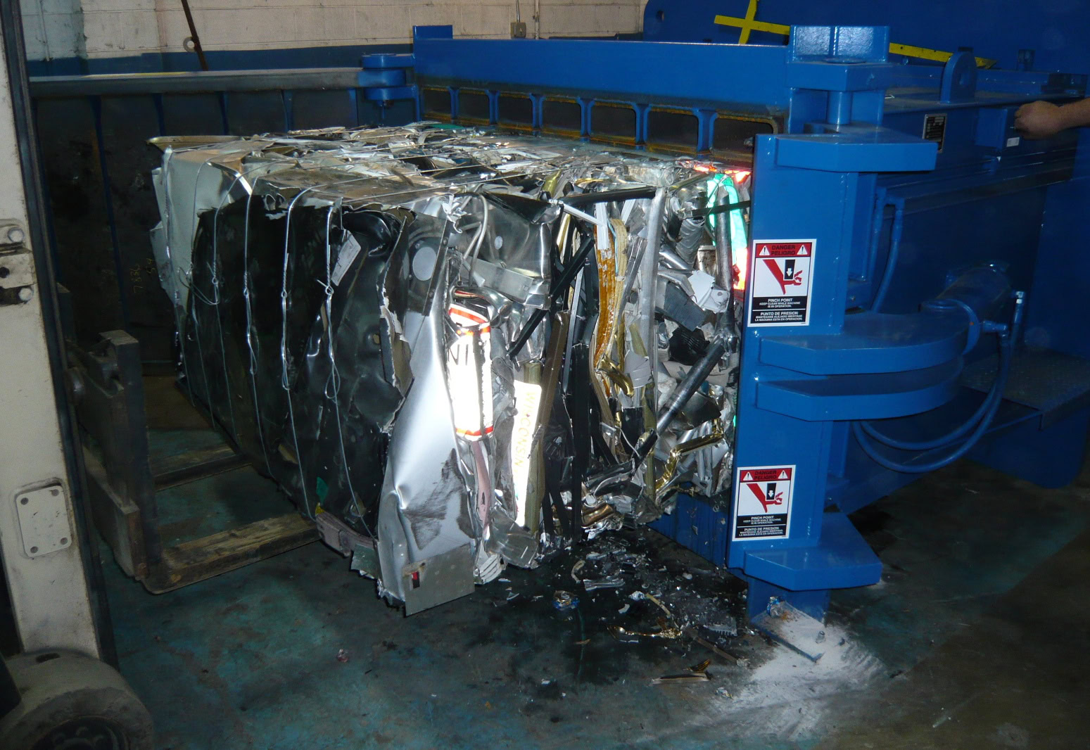 Dense non-ferrous scrap metal bale produced by heavy-duty baler ready for shipment