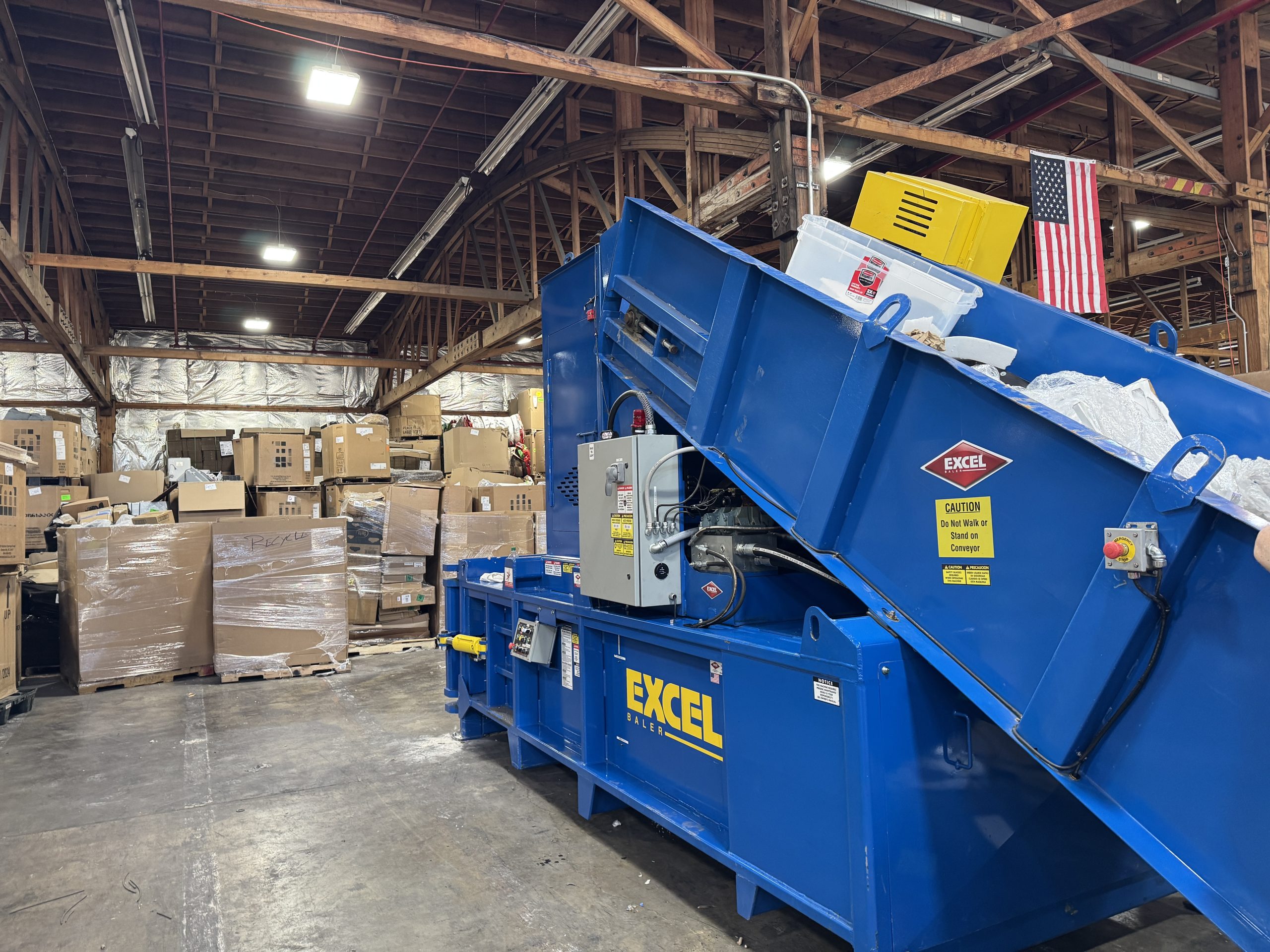 Excel EX63 horizontal manual-tie baler for a manufacturing plant