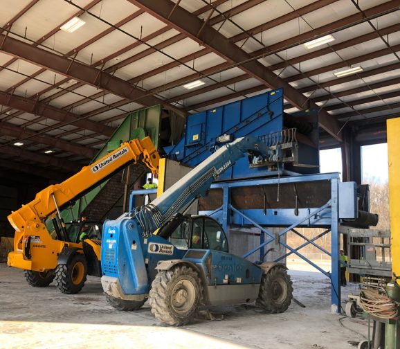 Two ram baler baling sorted commodities at a material recovery facility